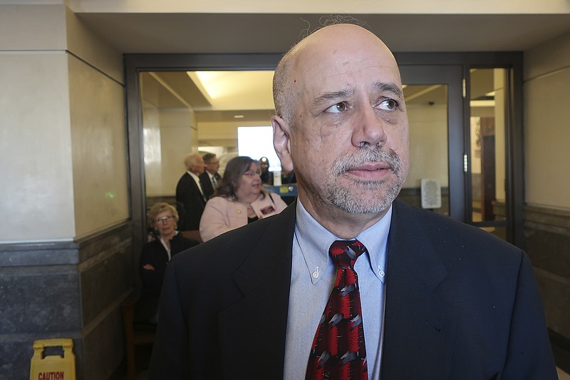 Kansas House Minority Leader Tom Sawyer, D-Wichita, answers questions from reporters as he prepares to depart from the Statehouse to a U.S. Department of Homeland Security briefing at a former Air Force base, Tuesday, Jan. 14, 2020, in Topeka, Kan. Sawyer later called the briefing "routine" event, though having the closed event away from the Statehouse was extraordinary for lawmakers. (AP Photo/John Hanna)