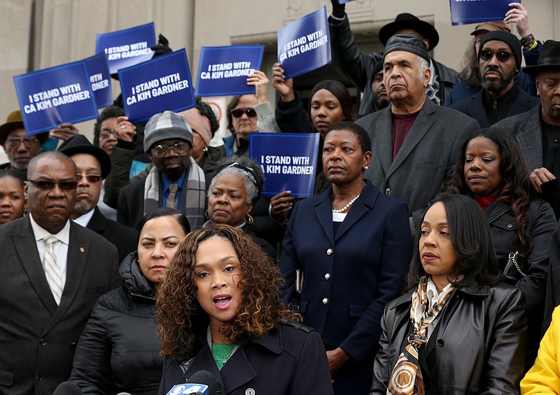 Baltimore State's Attorney Marilyn Mosby, center, speaks at a rally outside the Mel Carnahan Courthouse in St. Louis on Tuesday, Jan. 14, 2020, with several other African-American female prosecutors in support of Circuit Attorney Kimberly M. Gardner in her efforts to reform the criminal justice system and her suit against the St. Louis police union among others. Gardner has filed a federal civil rights lawsuit accusing the city, the local police union and others of a coordinated and racist conspiracy aimed at forcing her out of office. (Christian Gooden/St. Louis Post-Dispatch via AP)