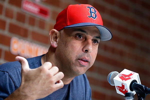 In this Sept. 9, 2019, file photo, Red Sox manager Alex Cora talks about the dismissal of president of baseball operations Dave Dombrowski during a news conference before the team's game against the Yankees in Boston. Cora was fired by the Red Sox on Tuesday, a day after baseball commissioner Rob Manfred implicated him in the sport's sign-stealing scandal.