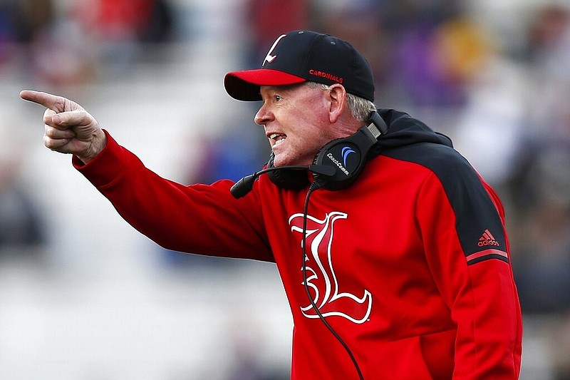 In this Oct. 13, 2018, file photo, then-Louisville head coach Bobby Petrino argues a call during the second half of an NCAA college football game against Boston College, in Boston. Petrino, a coach with a track record of on-the-field success but off-the-field embarrassments, will be the next coach at Missouri State, the university said Wednesday, Jan. 15, 2020. (AP Photo/Michael Dwyer, File)