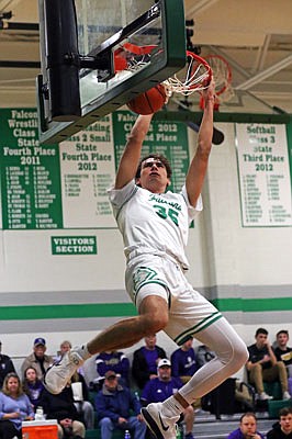 Eric Northweather of Blair Oaks throws down a two-handed dunk during Tuesday's game against Hallsville in Wardsville.