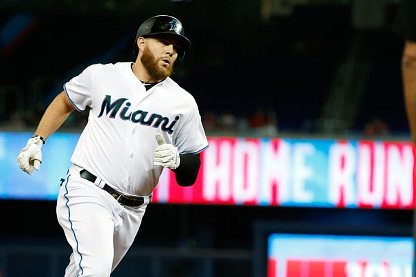 Austin Dean rounds third base after hitting a home run for the Marlins in a game last season against the Reds in Miami.