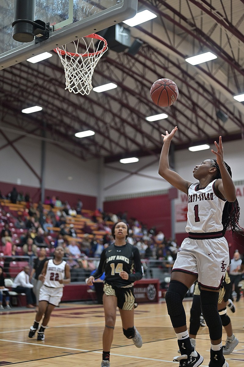 Eliyah Howard of Liberty-Eylau's Lady Leopards makes a shot against Pleasant Grove's Lady Hawks on Tuesday at the Rader Dome in Texarkana, Texas. The Lady Hawks defeated the Lady Leopards, 57-47. 