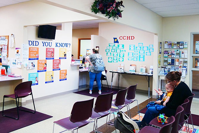 Patrons wait their turn Tuesday at the Callaway County Health Department. This week, the department started offering free postpartum depression screenings to local parents.
