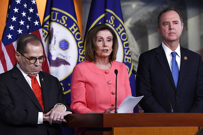 House Speaker Nancy Pelosi of Calif., center, flanked by House Judiciary Committee Chairman Rep. Jerrold Nadler, D-N.Y., left, and House Intelligence Committee Chairman Rep. Adam Schiff, D-Calif., speaks during a news conference to announce impeachment managers on Capitol Hill in Washington, Wednesday, Jan. 15, 2020. The U.S. House is set to vote Wednesday to send the articles of impeachment against President Donald Trump to the Senate for a landmark trial on whether the charges of abuse of power and obstruction of Congress are grounds for removal. (AP Photo/Susan Walsh)