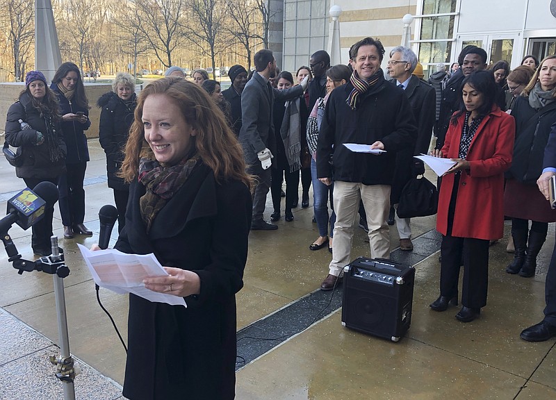 FILE - In this Wednesday, Jan. 8, 2020, file photo, Linda Evarts, an attorney for the International Refugee Assistant Project, speaks to the media outside the federal courthouse in Greenbelt, Md. A federal judge agreed Wednesday, Jan. 15, 2020, to block the Trump administration from enforcing an executive order allowing state and local government officials to reject refugees from resettling in their jurisdictions. U.S. District Judge Peter Messitte in Maryland issued a preliminary injunction requested by three national refugee resettlement agencies that sued to challenge the executive order. (AP Photo/Michael Kunzelman, File)