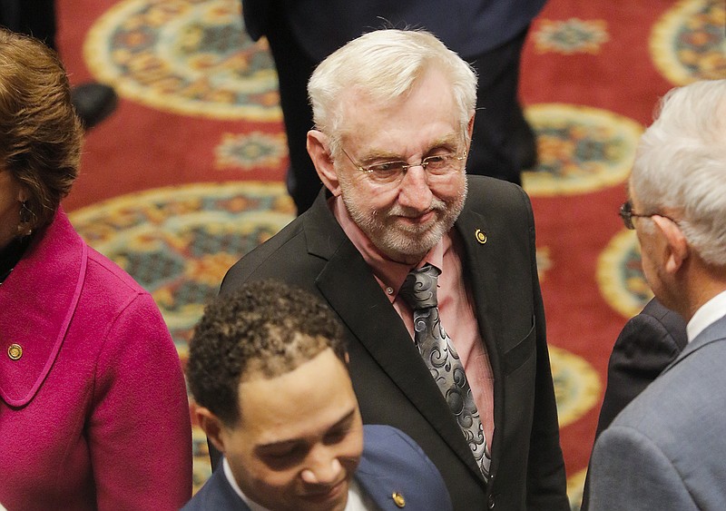 Rep. Rudy Veit, R-Wardsville, shakes hands with state legislators Wednesday, Jan. 15, 2020, during the entrance of Gov. Mike Parson at the annual State of the State address at the Missouri state Capitol.