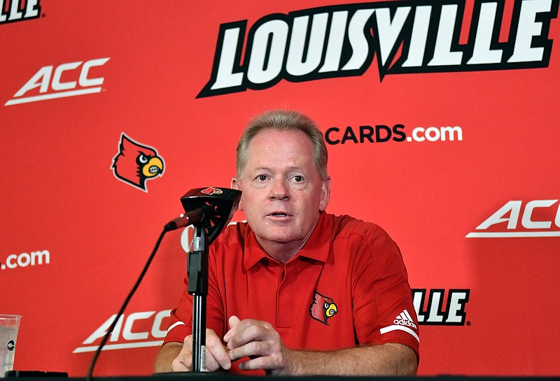In this Aug. 11, 2018, file photo, then-University of Louisville head football coach Bobby Petrino speaks to reporters during Louisville Football Media Day, in Louisville, Ky. Petrino, a coach with a track record of on-the-field success but off-the-field embarrassments, will be the next coach at Missouri State, the university said Wednesday, Jan. 15, 2020. (AP Photo/Timothy D. Easley, File)
