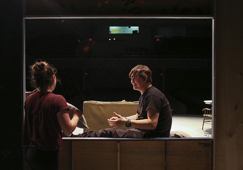 Emily Theissen chats with Levi Yoder onstage after cast and crew's dinner break Wednesday at the Miller Performing Arts Center. 