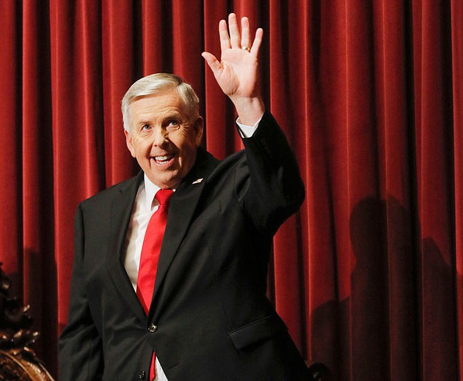 Liv Paggiarino/News Tribune
Gov. Mike Parson waves to the upper gallery Wednesday before making his way to the podium to give the annual State of the State address at the Capitol. Parson covered several topics, including a plan to reduce violent crime across the state. 