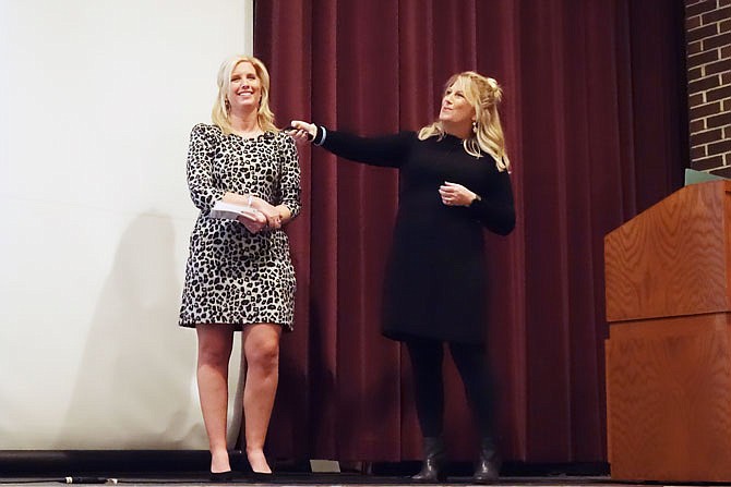 Lauren Murphy, left, and her mother, Colleen, share Lauren's story of surviving and recovering from a traumatic brain injury with a William Woods University audience Wednesday. Six years after her accident, Lauren has relearned how to eat, run and speak and now travels as an inspirational speaker.