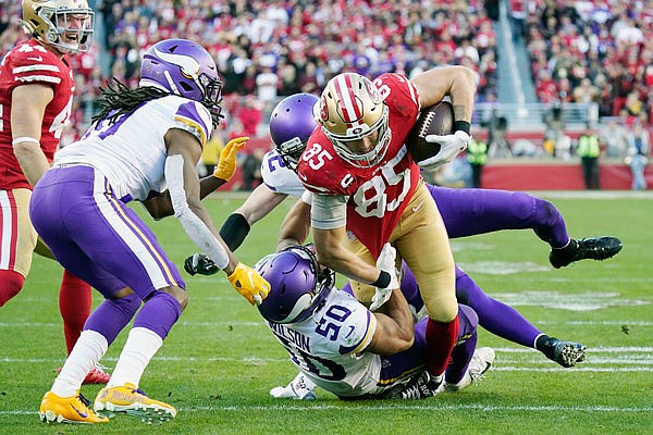 49ers tight end George Kittle runs as Vikings linebacker Eric Wilson attempts to make a tackle during last Saturday's game in Santa Clara, Calif.