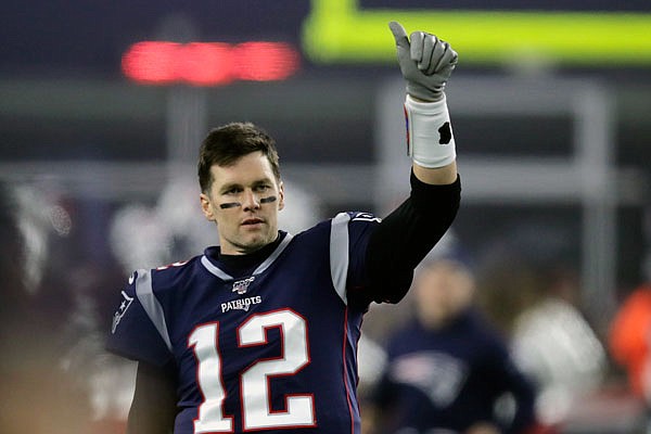 Patriots quarterback Tom Brady signals to a teammate before a playoff game earlier this month against the Titans in Foxborough, Mass.