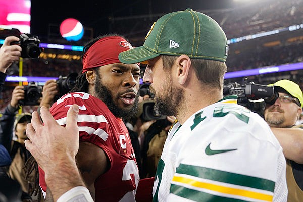 In this Nov. 24, 2019, file photo, 49ers cornerback Richard Sherman talks with Bay Packers quarterback Aaron Rodgers after a game in Santa Clara, Calif.