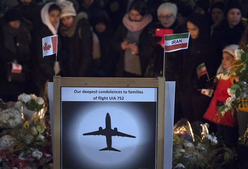 Mourners attend a memorial, Tuesday, Jan. 14, 2020, in North Vancouver, British Columbia, to remember Canadian victims in the deadly downing of a Ukrainian airliner the week before, in Iran. (Jonathan Hayward/The Canadian Press via AP)