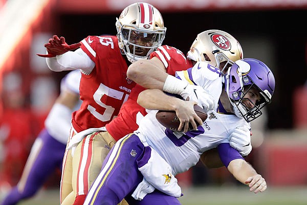 Vikings quarterback Kirk Cousins is tackled by 49ers defensive end Nick Bosa during last Sunday's game in Santa Clara, Calif.