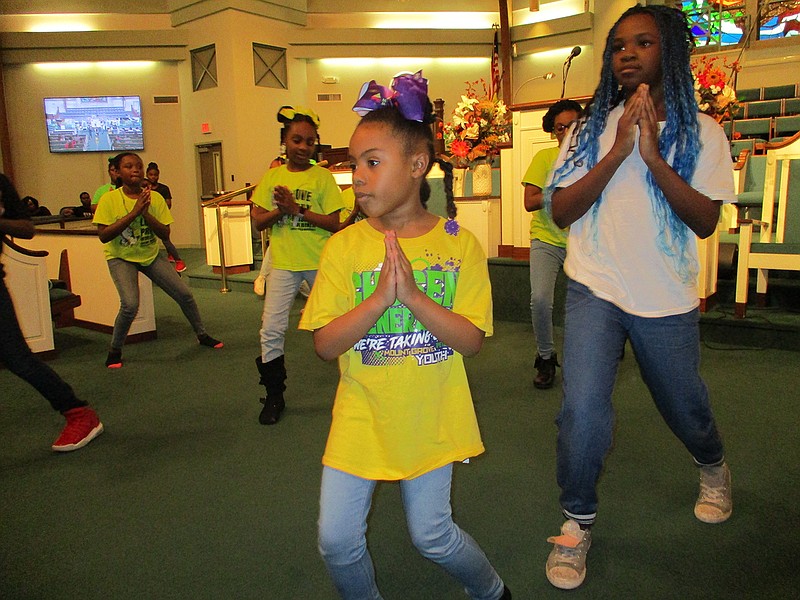  Community members perform a praise dance Saturday during the 28th annual Dr. Martin Luther King Jr. Celebration Weekend Prayer Breakfast at Lonoke Baptist Church. Events honoring Dr. King will continue locally throughout the next two days.
