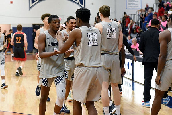 (From left) Lincoln's Lamont Ballard Jr. and Alafia Oluwasogo high-five each other after Saturday afternoon's win against Pittsburg State at Jason Gym.