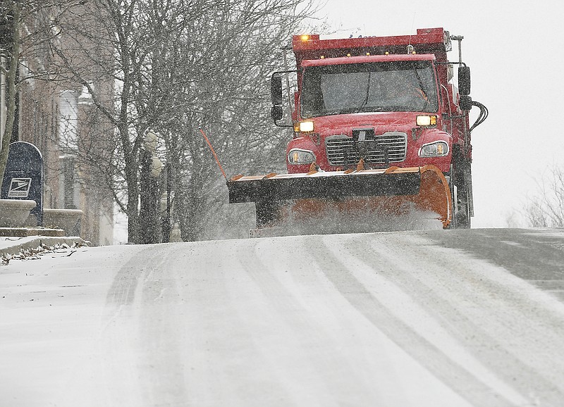 Jefferson City Public Works crews hit the streets Monday, Jan. 20, 2020, after an earlier-than-predicted snow began to fall late in the morning. The frozen pavement didn't take long to become slick and make safe travel difficult. 