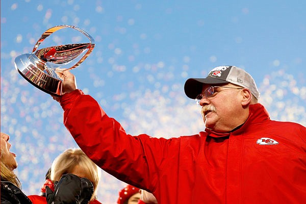 Chiefs head coach Andy Reid holds the Lamar Hunt Trophy after the AFC Championship Game on Sunday against the Titans at Arrowhead Stadium in Kansas City.