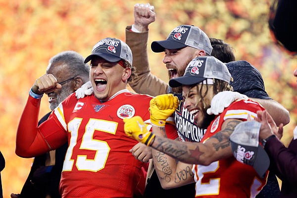 From left, Chiefs players Patrick Mahomes, Travis Kelce and Tyrann Mathieu celebrate after the AFC Championship Game against the Titans at Arrowhead Stadium in Kansas City. The Chiefs won 35-24 to advance to their first Super Bowl in 50 years.