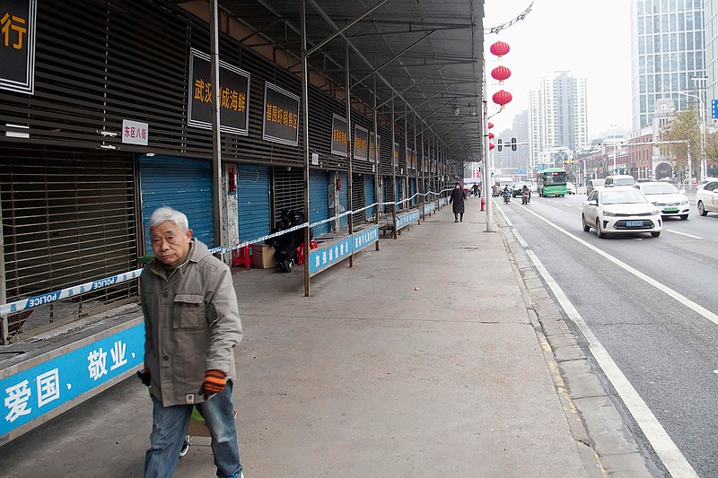 This Jan. 17, 2020, photo, shows the closed Huanan Seafood Wholesale Market in Wuhan, China. China reported Monday, Jan. 20 a sharp rise in the number of people affected in a pneumonia outbreak caused by a new coronoavirus, including the first cases in the capital. (Kyodo News via AP)