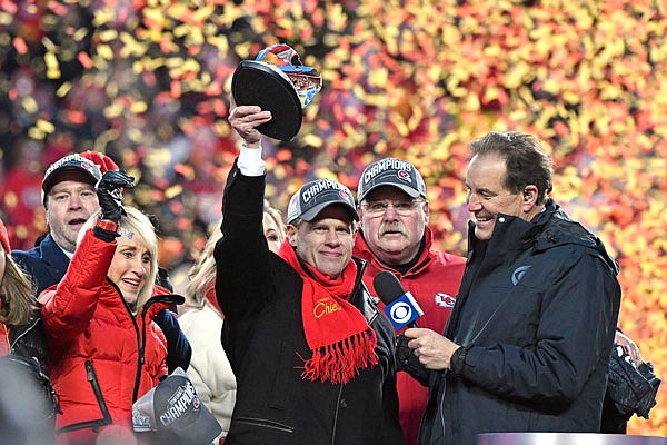 Norma Hunt (left) and her son Clark Hunt (center), owners of the Chiefs, and Chiefs head coach Andy Reid (second from right) celebrate Sunday after the NFL Championship Game against the Titans at Arrowhead Stadium in Kansas City.