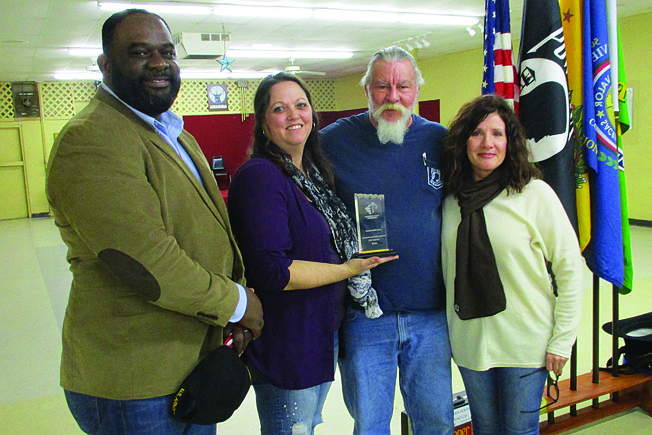 From left to right, Charles Jordan, director of the VA's local outpatient clinic; Kenda Watson, the clinic's former director; Greg Beck, Vietnam Veterans of America Chapter 278 president; and Patricia Harris, veterans representative for the Texas Veterans Commission's Employment Service, gather Sunday.