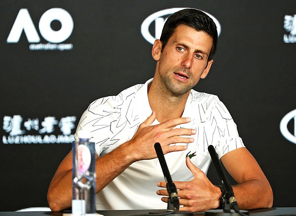 Novak Djokovic gestures during a press conference Sunday ahead of the Australian Open in Melbourne, Australia.