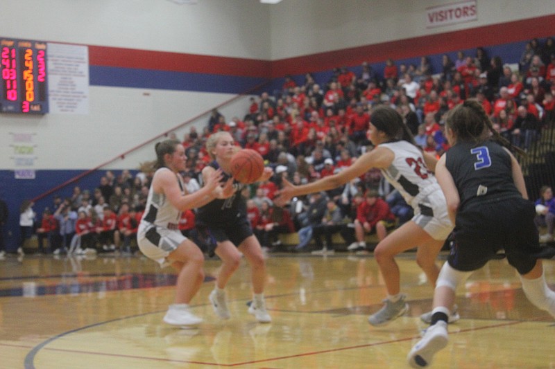 <p>Democrat photo/Kevin Labotka</p><p>Bailey Lage passes the ball to Tristan Porter Jan. 18 during the Pintos’ 51-39 win over Southern Boone in the championship game of the California girls tournament.</p>