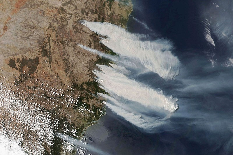 This Nov. 8, 2019, satellite photo taken by NASA shows hot, dry and windy weather conditions as bushfires burn in the eastern part of the New South Wales state of Australia. Some scientists and forestry experts doubt that re-seeding and other intervention efforts can match the scope of the destruction. (NASA via AP)