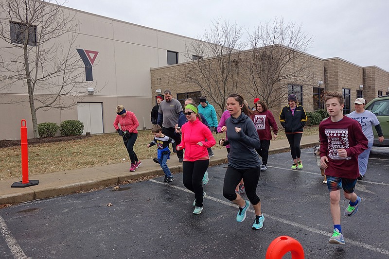 <p>Helen Wilbers/For the News Tribune</p><p>About 20 human runners — and one dog — set off on the YMCA of Callaway County’s Hot Cocoa Hustle 5K in 2018.</p>
