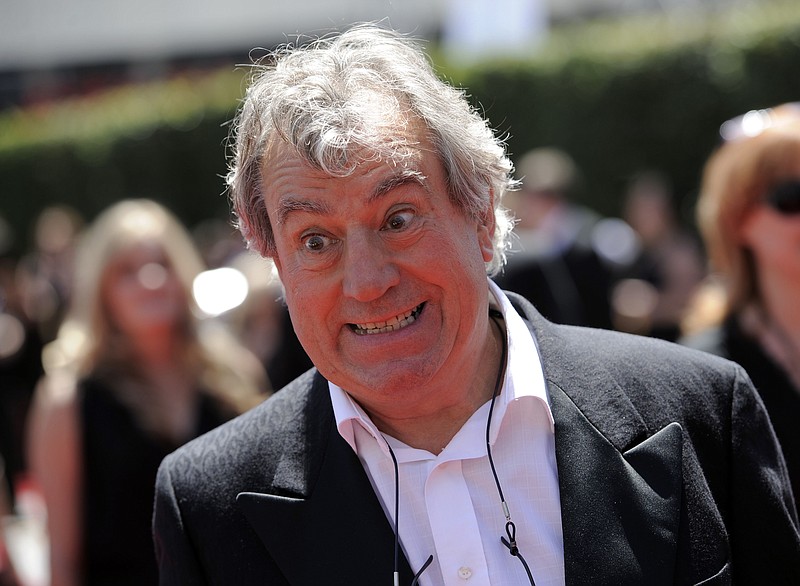 In this Saturday, Aug. 21, 2010 file photo, Terry Jones arrives at the Creative Arts Emmy Awards in Los Angeles. Terry Jones, a member of the Monty Python comedy troupe, has died at 77. Jones's agent says he died Tuesday Jan. 21, 2020. In a statement, his family said he died "after a long, extremely brave but always good humored battle with a rare form of dementia, FTD." (AP Photo/Chris Pizzello, file)
