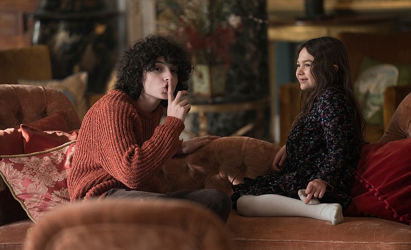 This image released by Universal Pictures shows Finn Wolfhard and Brooklynn Prince in a scene from "The Turning." (Patrick Redmond/Universal Pictures via AP)