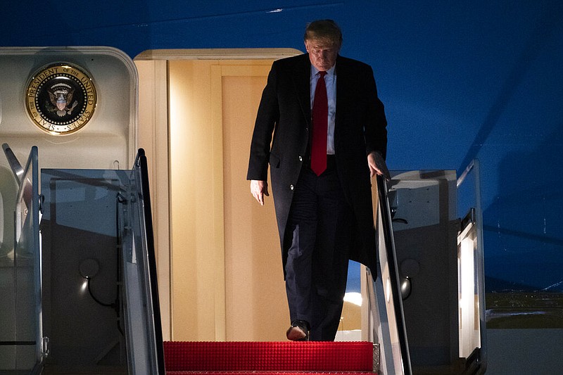 President Donald Trump exits Air Force One on Wednesday, Jan. 22, 2020, at Andrews Air Force Base, Md., after returning from the World Economic Forum in Davos, Switzerland.