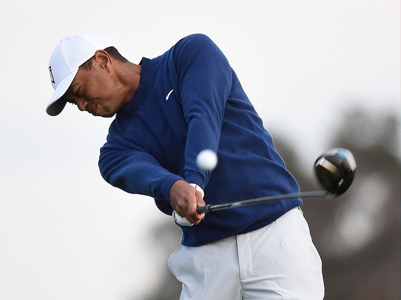 Tiger Woods hits his tee shot on the fifth hole during the pro-am round of the Farmer's Insurance golf tournament on the South Course at Torrey Pines Golf Course on Wednesday, Jan. 22, 2020, in San Diego. (AP Photo/Denis Poroy)