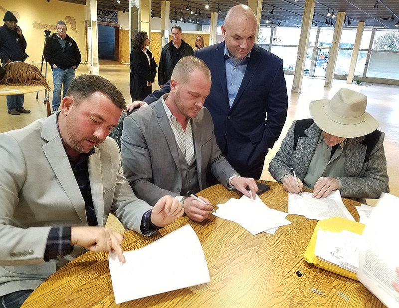 Justin Jones, Joe Gay and Les Munn, shown here Wednesday, Jan. 22, at the Moore's Home Furnishings building downtown, intend to turn the space into a multi-purpose entertainment venue that recalls the building's history.