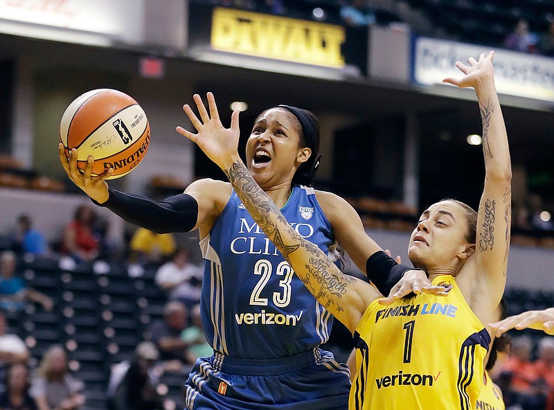 In this Aug. 30, 2017, file photo, Minnesota Lynx's Maya Moore shoots against Indiana Fever's Jazmon Gwathmey during the first half of a game in Indianapolis. Moore will sit out a second straight WNBA season in 2020 to continue her push for criminal justice reform. 