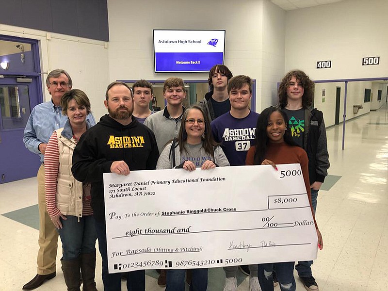 The Margaret Daniel Educational Foundation presented an $8,000 grant to the Ashdown High School computer science department along with the baseball team for a batting and pitching Rapsodo camera. Pictured from left are board members Thad Bishop and Kari Harger, baseball coach Chuck Cross, Cameron Reed, Marty Lansdell, teacher Stephanie Ringgold, Gavin Ketcher, Derek Hilton, Trinity Lewis and Mason Bush. (Submitted photo)