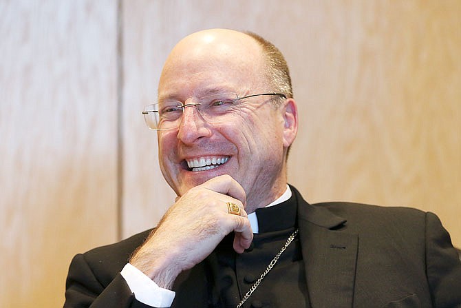 Bishop Shawn McKnight laughs Wednesday, Jan. 22, 2020, during a light-hearted moment in an interview with the News Tribune at the Catholic Diocesan Chancery.