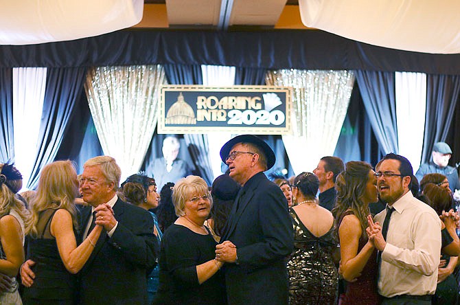 Couples sway together on the dance floor Friday during the after-party of the 127th annual Jefferson City Area Chamber of Commerce Gala at the Capitol Plaza Hotel. The after-party also featured free beer, provided by NH Scheppers.
