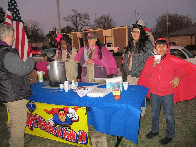 The Super Webelos of Pack 19 serve chili at the sixth annual Bridge City Project on Friday evening in an open area in the 400 block of East Fourth Street. The annual event helps raise funds to support services for the homeless in Texarkana.
