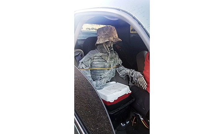 This Thursday, Jan. 23, 2020, photo provided by the Arizona Department of Public Safety shows a dummy skeleton found after a State Trooper traffic stop of a 62-year-old man for an HOV lane violation in Phoenix. (Arizona Department of Public Safety via AP)