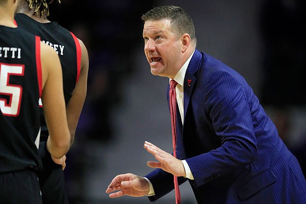 Texas Tech coach Chris Beard talks with his players during the second half a game earlier this month against Kansas State in Manhattan, Kan.