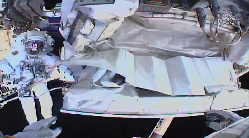 This photo provided by NASA shows the view from NASA's Andrew Morgan's helmet cam as Italian astronaut Luca Parmitano works outside the International Space Station during a spacewalk Saturday, Jan. 25, 2020.  The astronauts worked to complete repairs to a cosmic ray detector outside the International Space Station.   (NASA via AP)