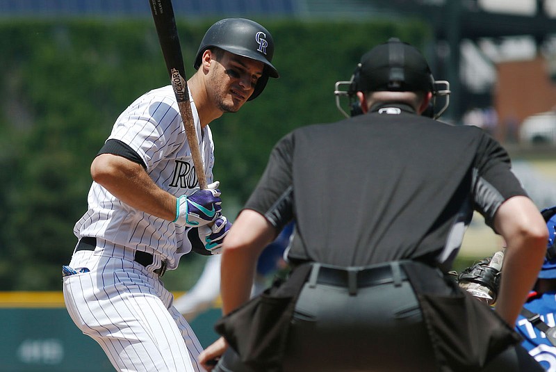 In this June 29, 2016, file photo, Nolan Arenado of the Rockies reacts as home plate umpire Nic Lentz calls a strike on a pitch from Blue Jays starting pitcher Aaron Sanchez in the first inning of a game in Denver. 
