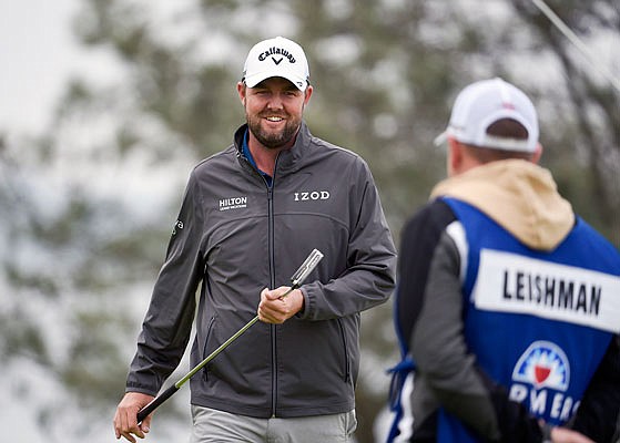 Marc Leishman smiles after putting on the fourth hole during Sunday's final round of the Farmers Insurance Open in San Diego.