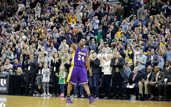 In this March 28, 2016, file photo, Kobe Bryant of the Lakers waves as he walks off the court during the second half of a game against the Jazz in Salt Lake City. Bryant, the 18-time NBA All-Star who won five championships and became one of the greatest players of his generation during a 20-year career with the Lakers, died in a helicopter crash Sunday.