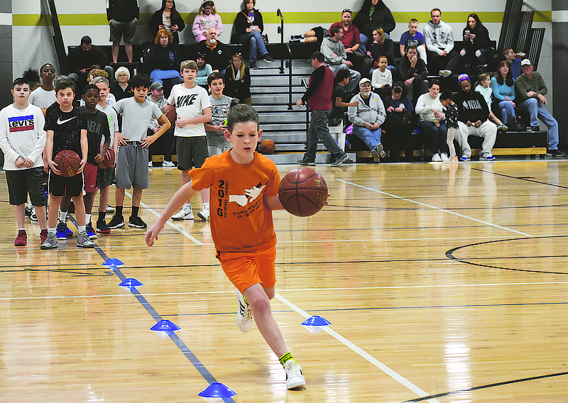 Clayton Moore dribbles around cones during Sunday's Jr. NBA Skills Challenge at The Linc. He scored 10 points at the competition. The event attracted 37 competitors, more than in past years.