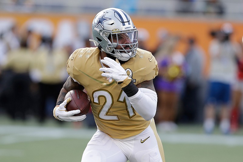 NFC running back Ezekiel Elliott of the Dallas Cowboys runs with the football during the second half of the NFL Pro Bowl on Sunday in Orlando, Fla. The AFC defeated the NFC 38-33.